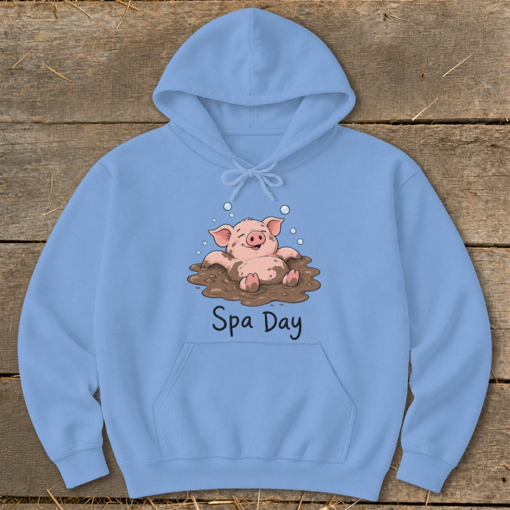 Light blue hoodie with cartoon pig in mud captioned "Spa Day".