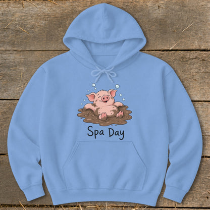 Light blue hoodie with cartoon pig in mud captioned "Spa Day".