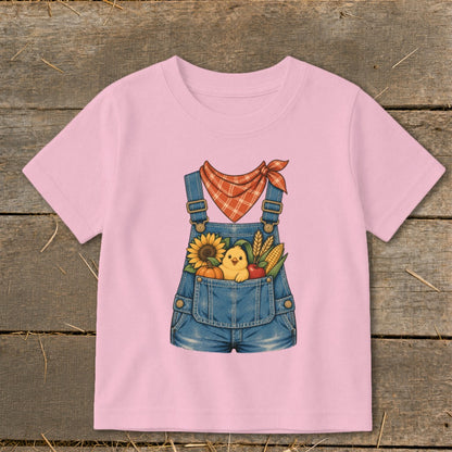 Pink t-shirt with denim overalls graphic featuring a chick, sunflower, pumpkin, corn, and apple.