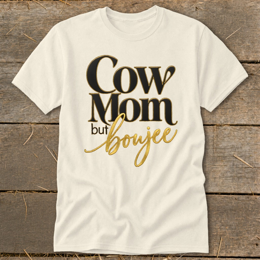 Cream t-shirt with "Cow Mom but boujee" text in black and gold lettering.