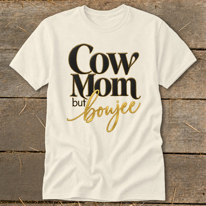 Cream t-shirt with "Cow Mom but boujee" text in black and gold lettering.