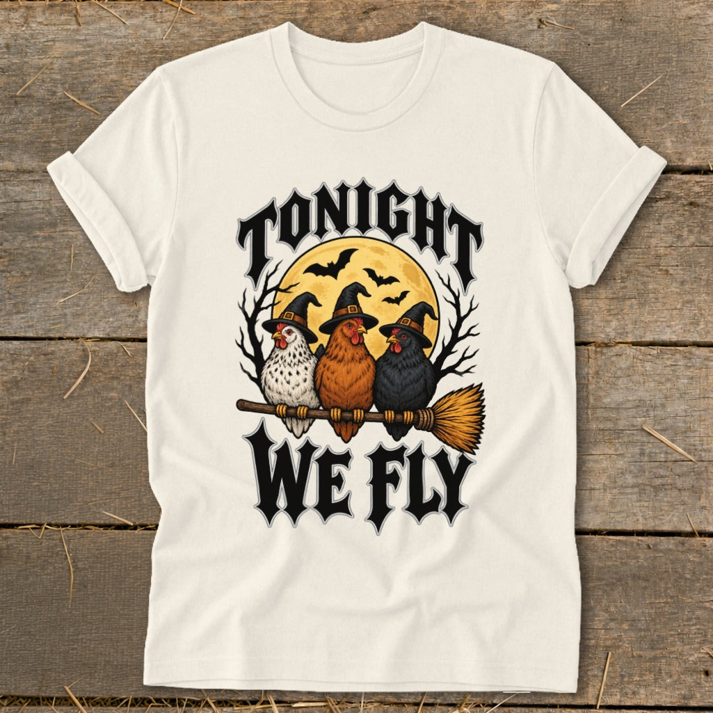 Three chickens in witch hats ride a broomstick under "TONIGHT WE FLY" text.