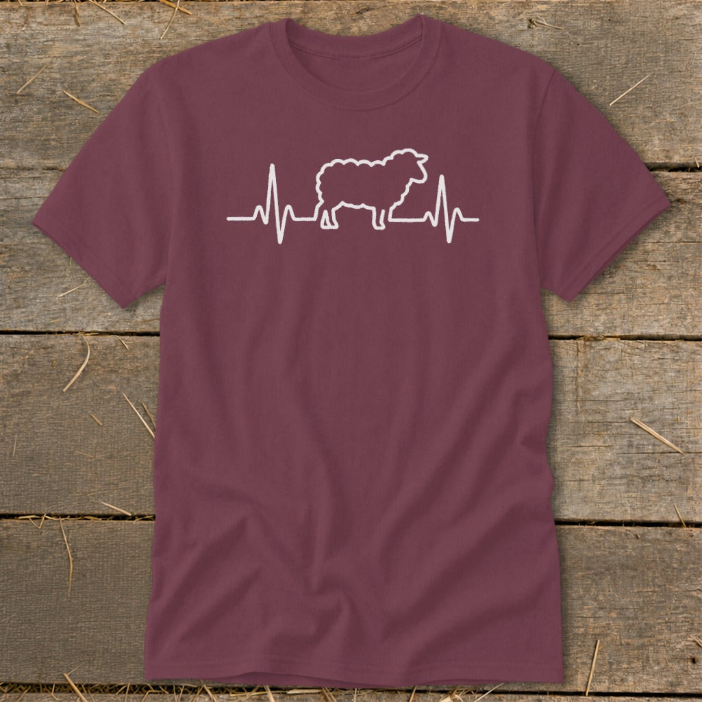 A maroon crewneck t-shirt featuring a white graphic of a sheep integrated into a heartbeat line.