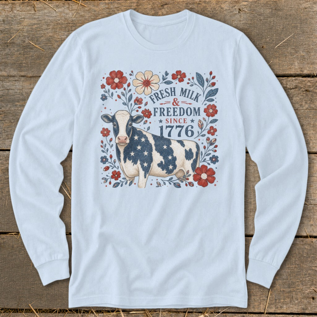 Cow with American flag pattern and patriotic floral design, text reads "Fresh Milk & Freedom Since 1776".