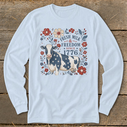 Cow with American flag pattern and patriotic floral design, text reads "Fresh Milk & Freedom Since 1776".