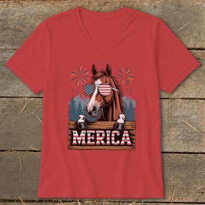 Horse wearing patriotic sunglasses peeks over a sign that says "MERICA" with fireworks.
