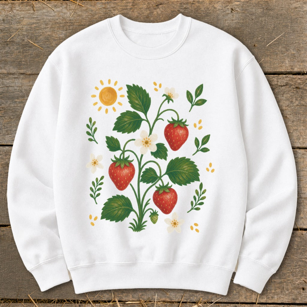 White sweatshirt with a watercolor strawberry plant, sun, and flowers illustration.
