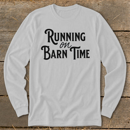 Light grey long-sleeve shirt with black text "Running on Barn Time".