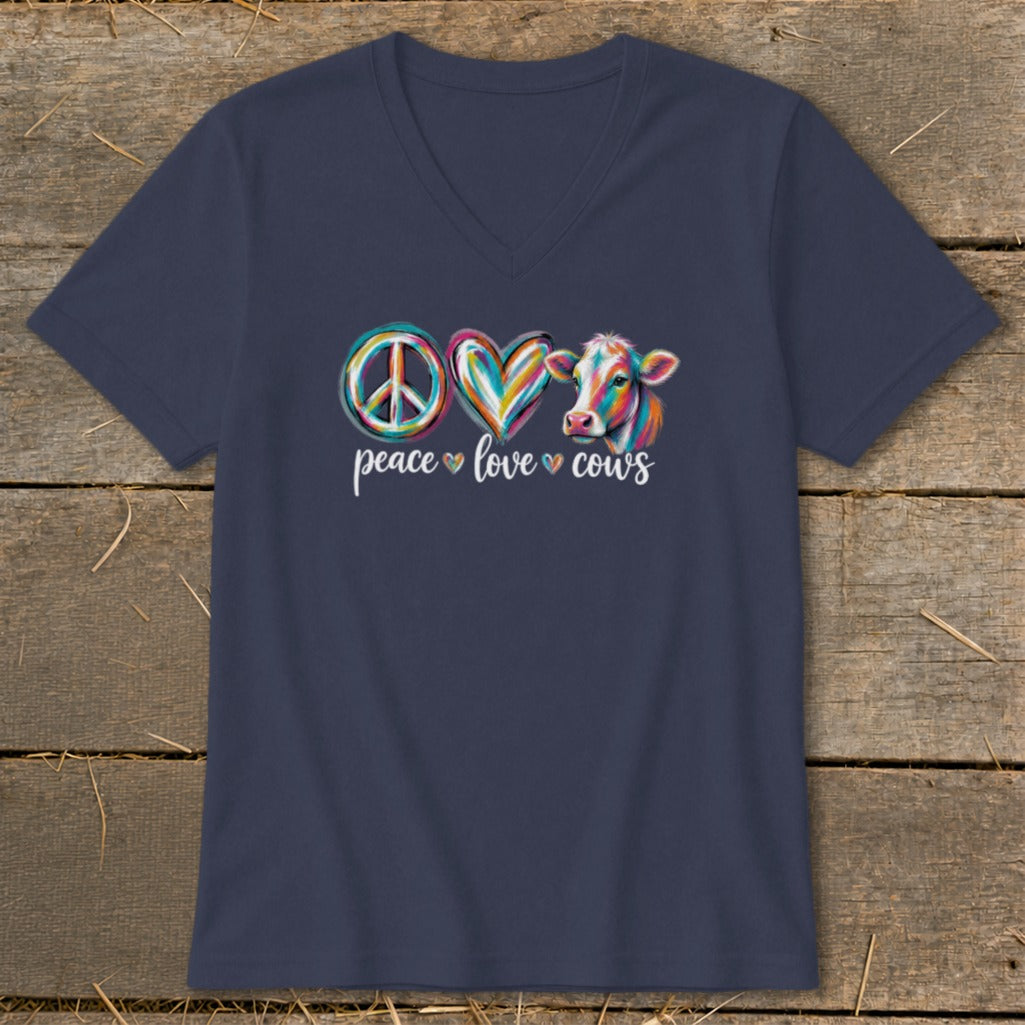 Navy v-neck t-shirt with colorful peace sign, heart, and cow graphic that says "peace love cows".