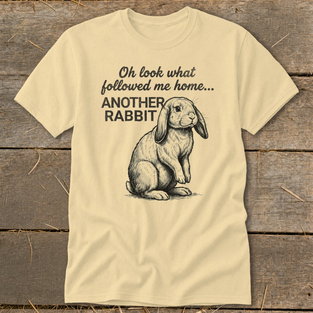 T-shirt with text "Oh look what followed me home... ANOTHER RABBIT" and a drawing of a rabbit.