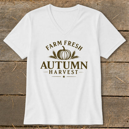 White V-neck t-shirt with brown text "FARM FRESH AUTUMN HARVEST" and pumpkin graphic.