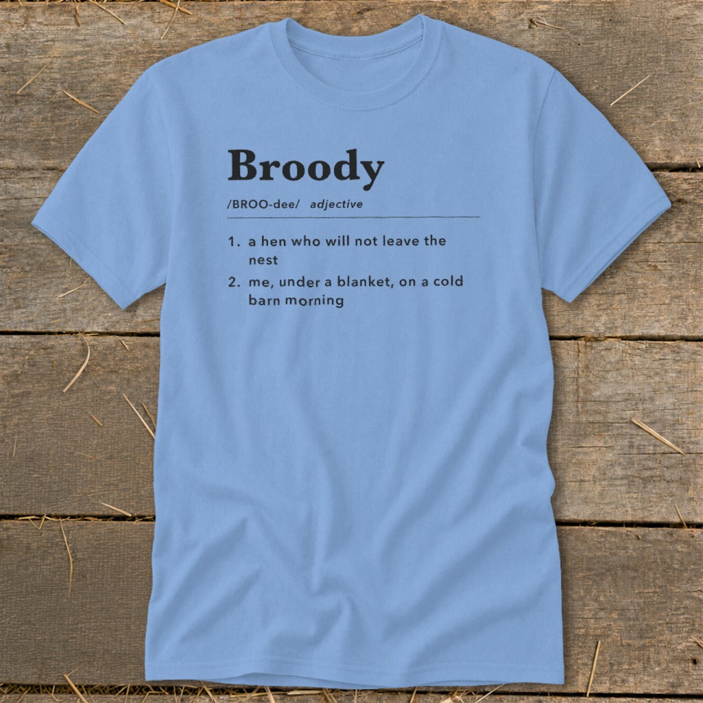 Light blue t-shirt with "Broody" definition: hen not leaving nest and me under blanket.