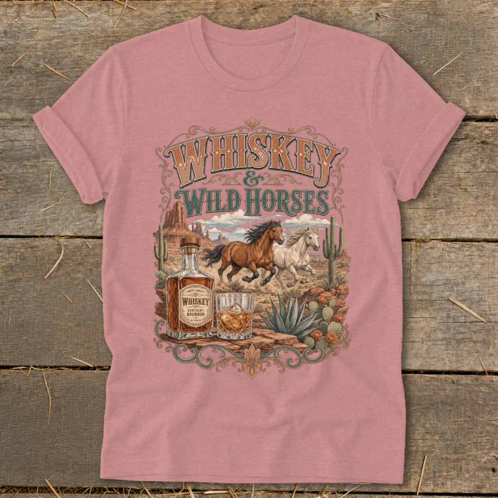 Whiskey and Wild Horses desert scene with bottle and glass on a pink t-shirt.