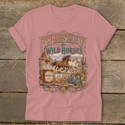 Whiskey and Wild Horses desert scene with bottle and glass on a pink t-shirt.