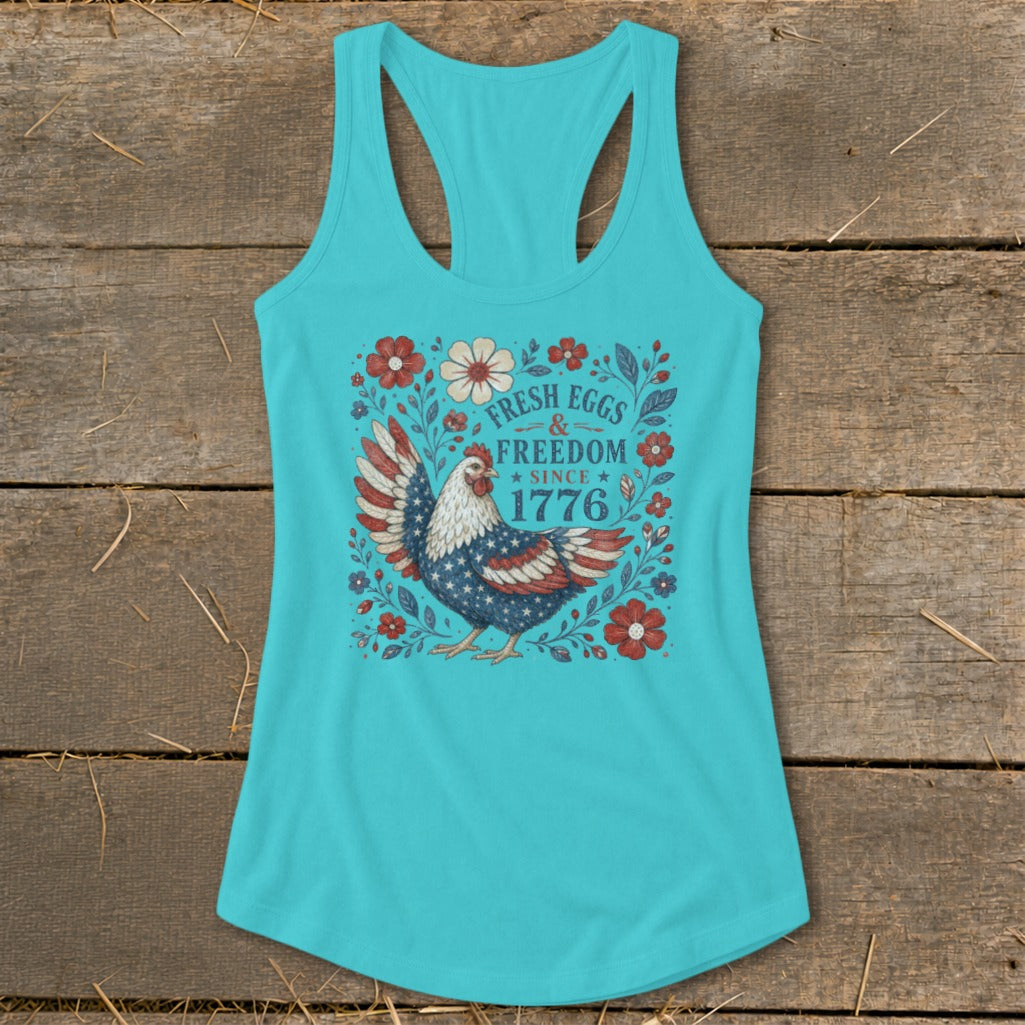Turquoise tank top with a chicken and "Fresh Eggs & Freedom Since 1776" design.