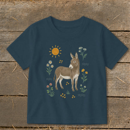 Navy t-shirt with illustration of a donkey surrounded by sun, flowers, and clover.