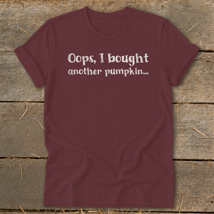 Maroon t-shirt with white text "Oops, I bought another pumpkin..."