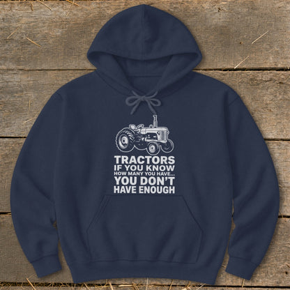Navy hoodie with white tractor graphic and text reading "Tractors if you know how many you have... you don't have enough".