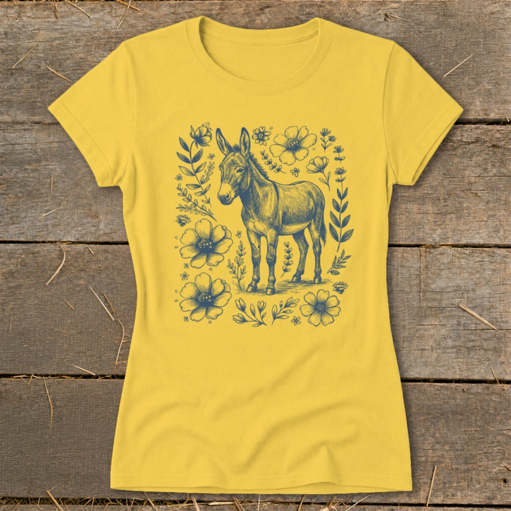 Yellow t-shirt with a blue sketch of a donkey surrounded by flowers and leaves.