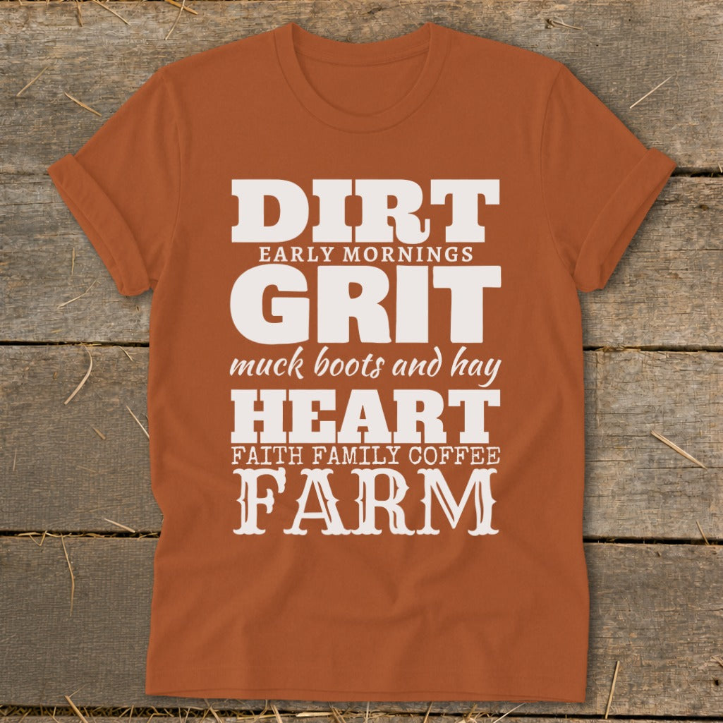 Orange t-shirt with text: "DIRT EARLY MORNINGS GRIT muck boots and hay HEART FAITH FAMILY COFFEE FARM"