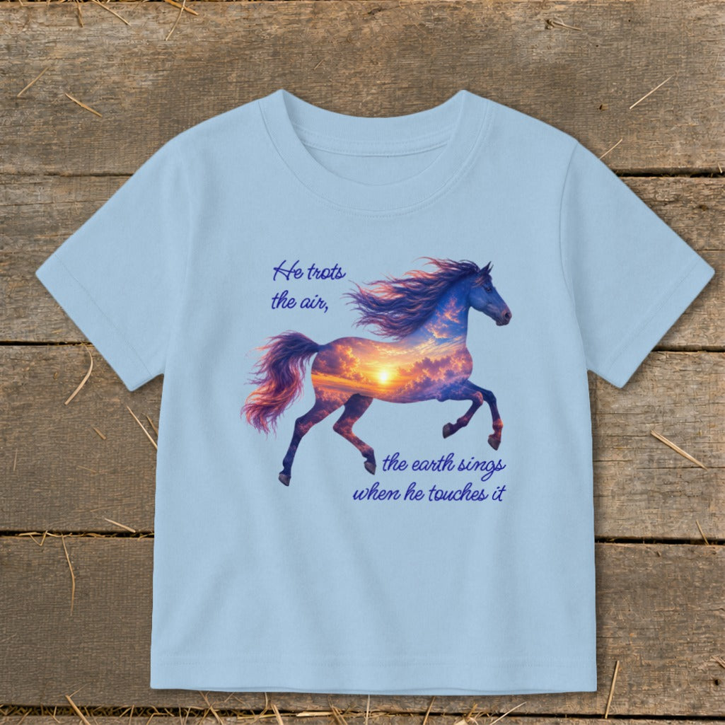 Light blue children's t-shirt printed with a sunset-filled horse silhouette and text that reads "He trots the air, the earth sings when he touches it".
