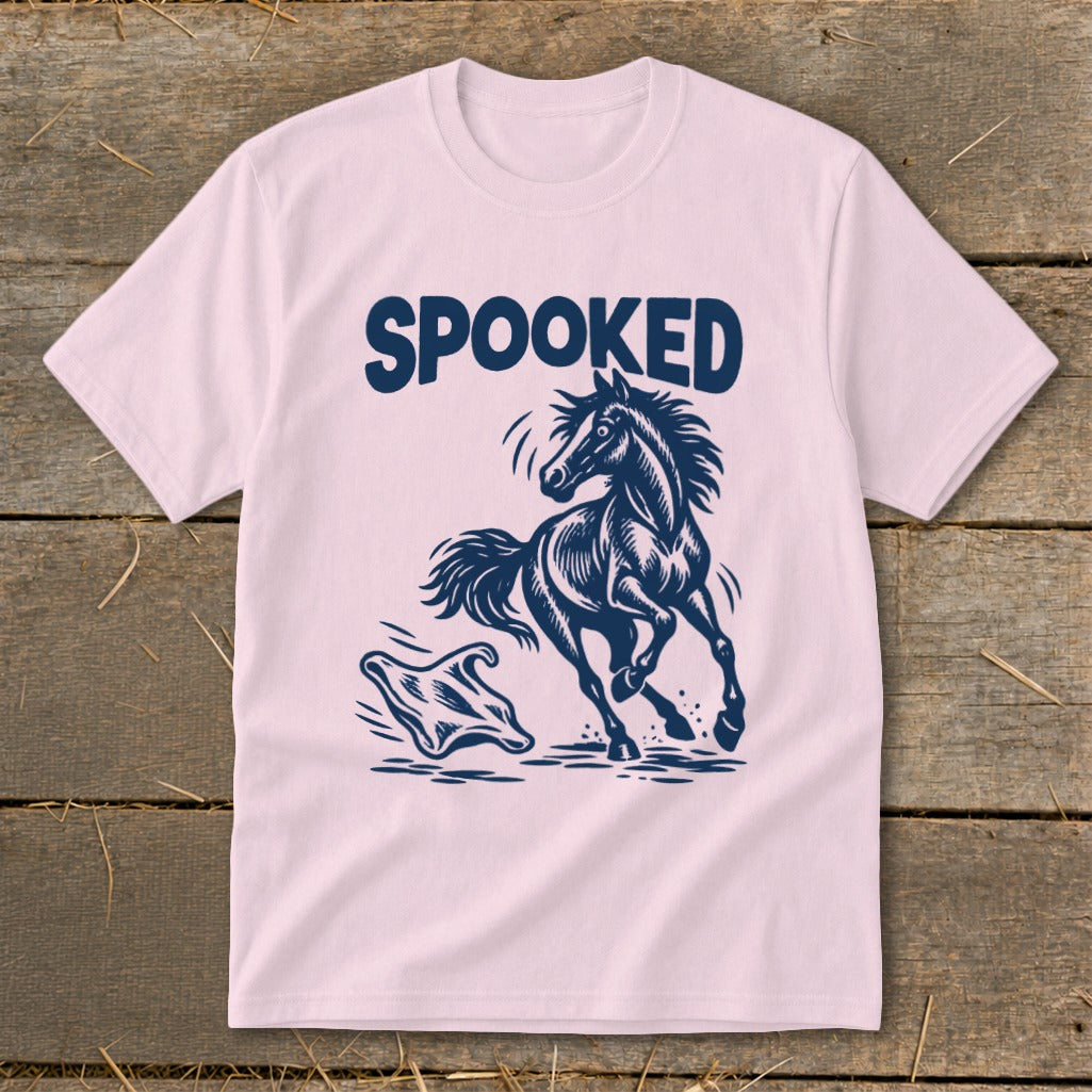 Pink t-shirt with navy blue "SPOOKED" text and a startled horse next to a ghost.