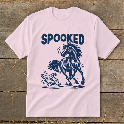 Pink t-shirt with navy blue "SPOOKED" text and a startled horse next to a ghost.