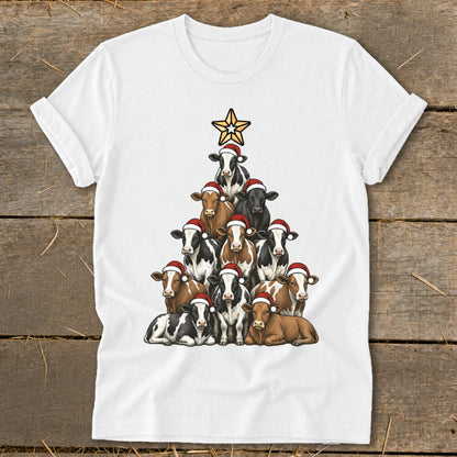 Cows wearing Santa hats arranged in a Christmas tree shape with a star on top.