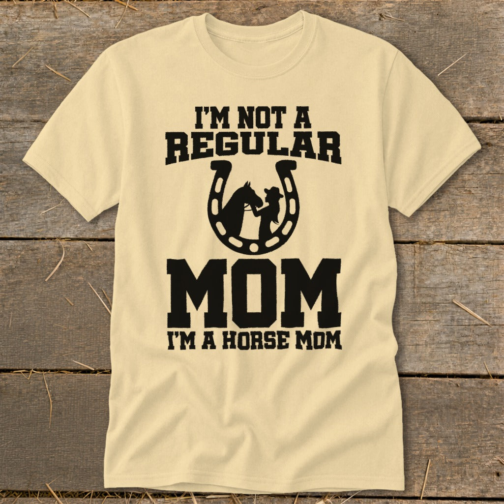 Light yellow t-shirt with "I'M NOT A REGULAR MOM" and horse graphic in horseshoe.