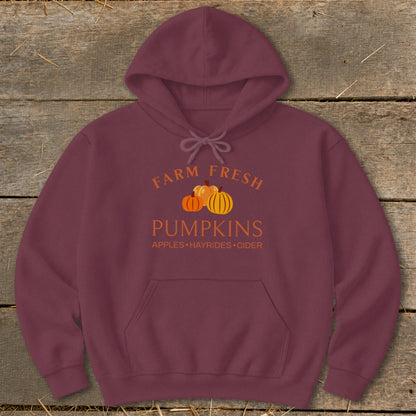 Maroon hoodie with "Farm Fresh Pumpkins" graphic and autumn harvest text.