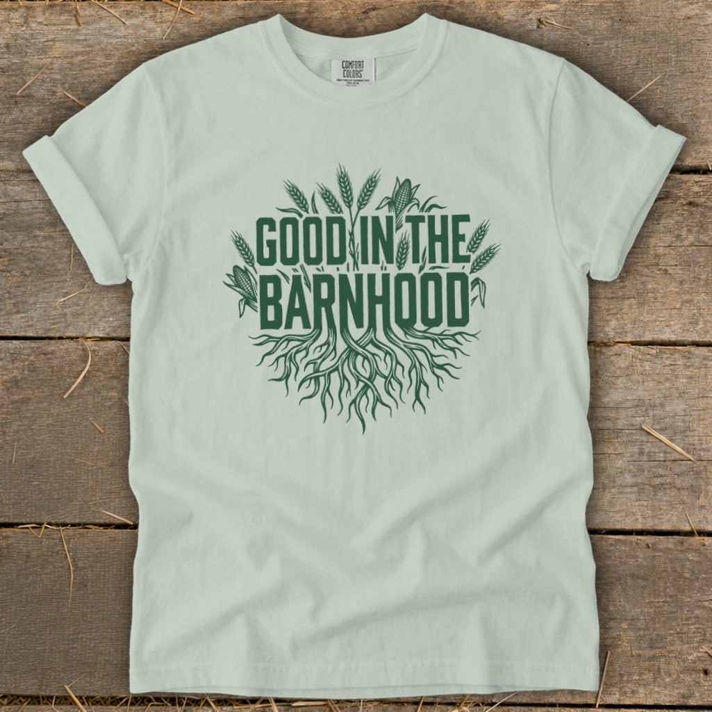 Light green t-shirt with "Good in the Barnhood" graphic featuring roots and crops.