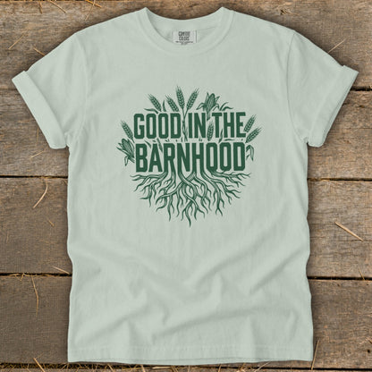 Light green t-shirt with "Good in the Barnhood" graphic featuring roots and crops.