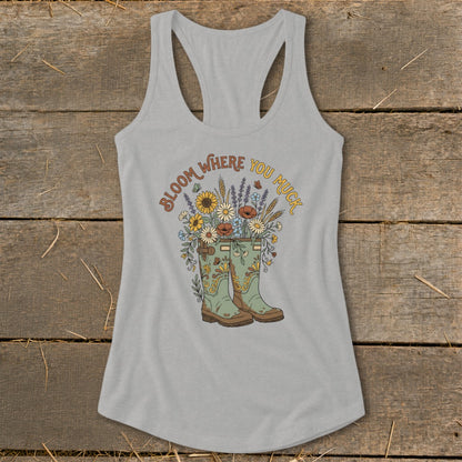 Gray tank top with "Bloom Where You Muck" and floral garden boots graphic.