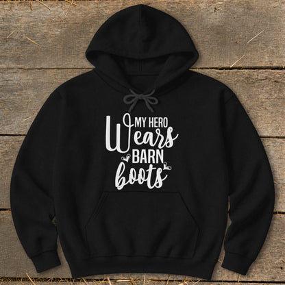 Black hoodie with white text "My Hero Wears Barn Boots."