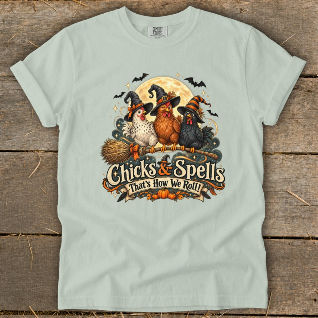 Three witch chicks in hats sit on a broom with "Chicks & Spells" text.