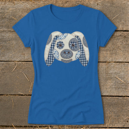 Blue t-shirt with a patchwork dog face graphic on the front.