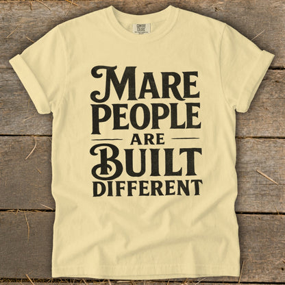 Pale yellow t-shirt with black text that reads "Mare People Are Built Different".