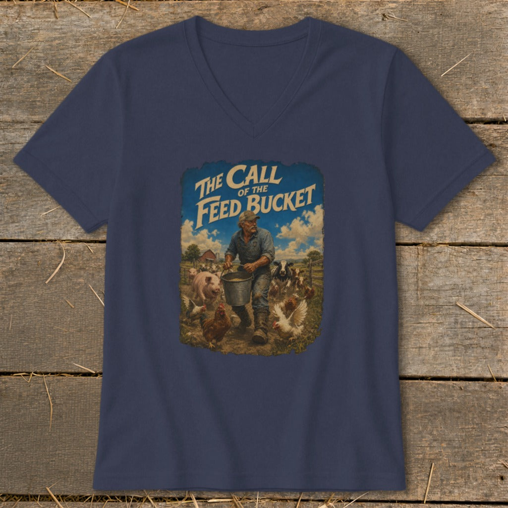 T-shirt graphic with farmer feeding pigs and chickens, text "The Call of the Feed Bucket".