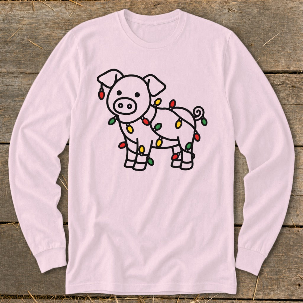 A light pink long-sleeve t-shirt featuring a black-outlined pig tangled in colorful Christmas lights.