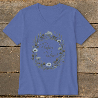 Periwinkle v-neck t-shirt with a floral wreath graphic and text "Pasture Raised".