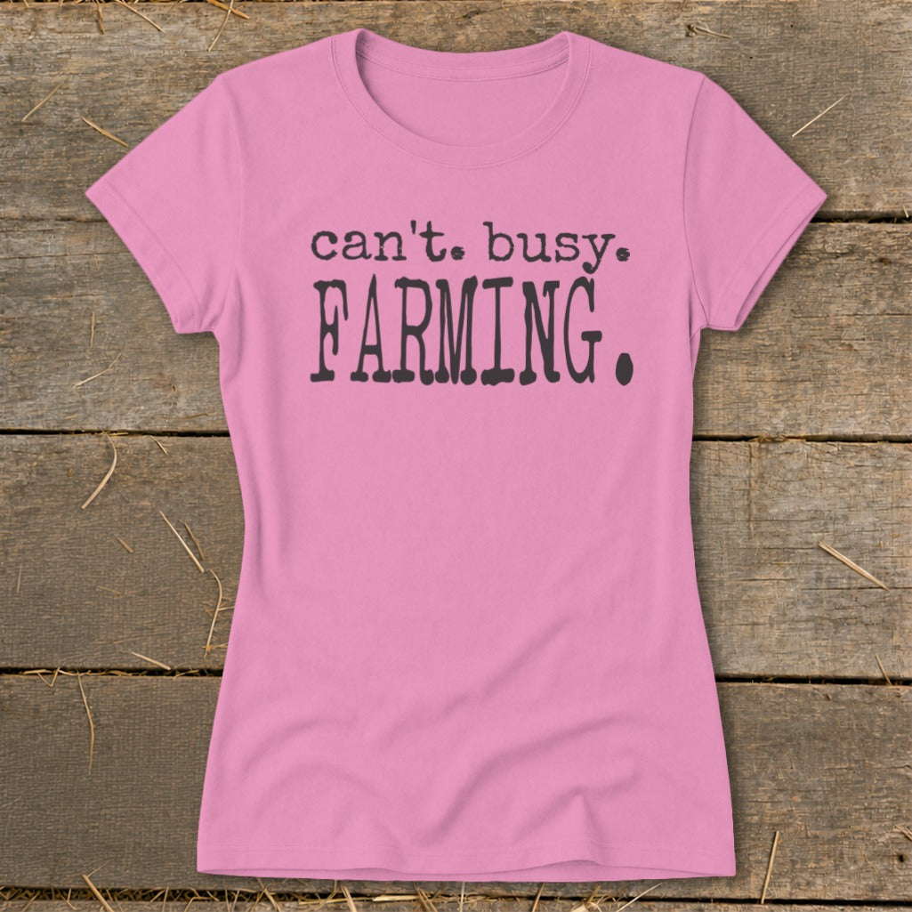 Pink t-shirt with "can't. busy. FARMING." text.