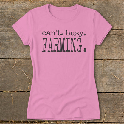 Pink t-shirt with "can't. busy. FARMING." text.