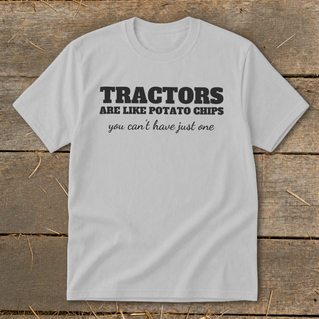 Light grey t-shirt with black text reading "TRACTORS ARE LIKE POTATO CHIPS you can't have just one."
