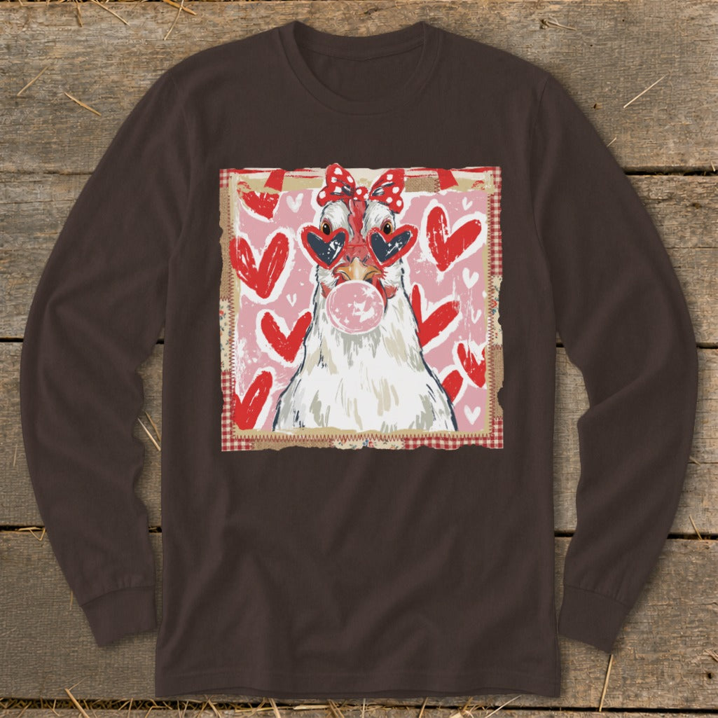 White chicken in heart sunglasses blowing pink bubble gum, red hearts background.