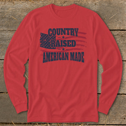 Red long sleeve shirt with "Country Raised American Made" and American flag graphic.