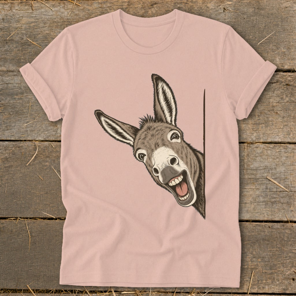 Pink t-shirt with a cartoon donkey peeking and smiling.
