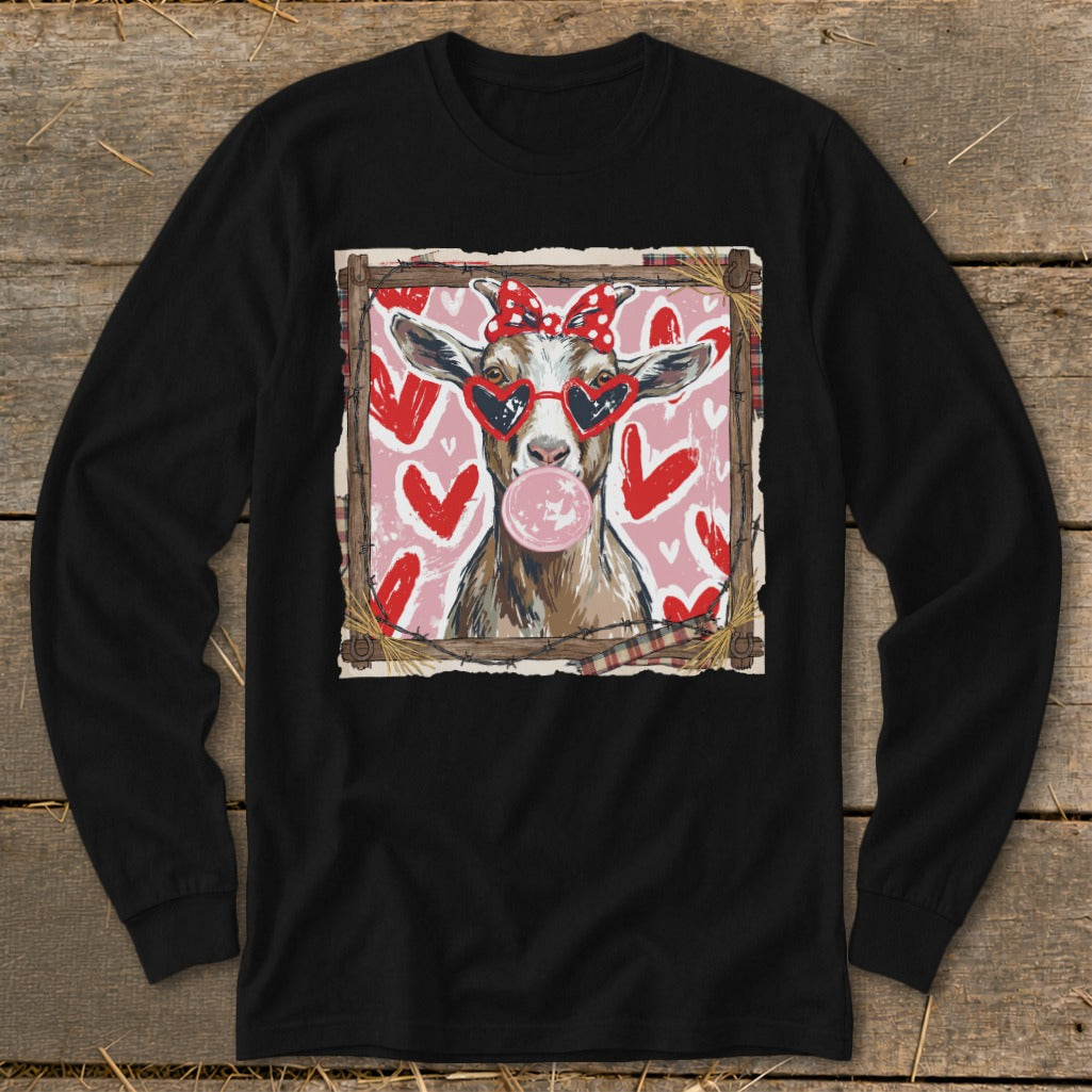 Goat wearing heart sunglasses and a bow blows bubblegum on a pink background with hearts.