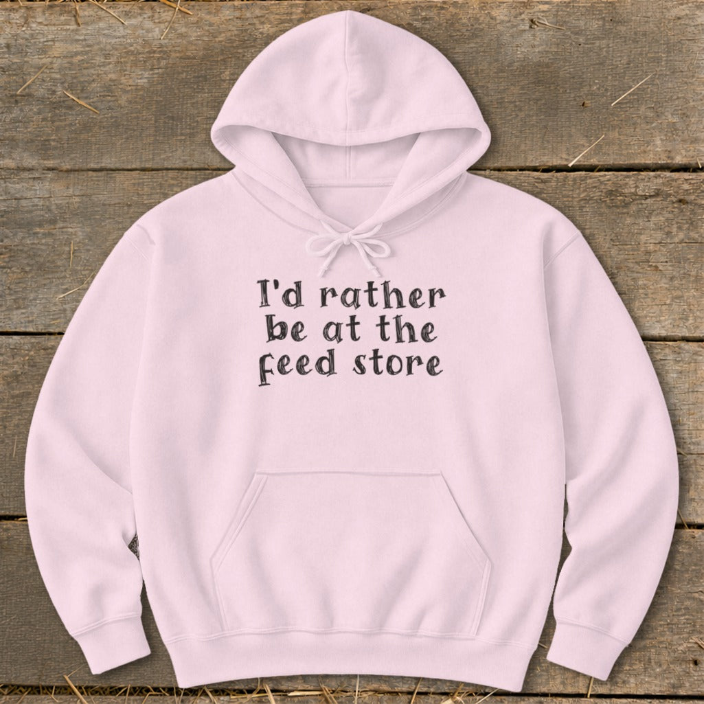 Light pink hoodie with "I'd rather be at the feed store" text.