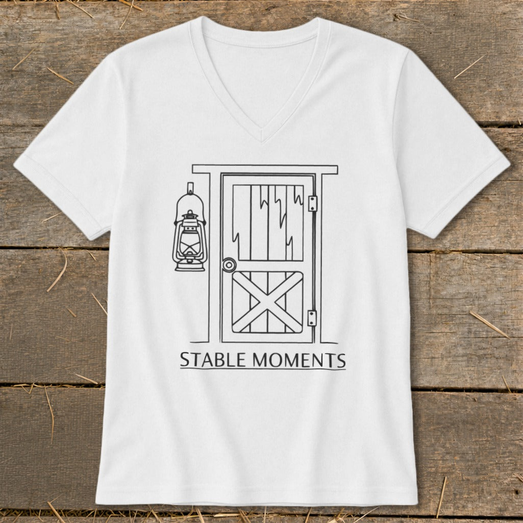 White t-shirt with a line drawing of a stable door and hanging lantern, text reads "STABLE MOMENTS".