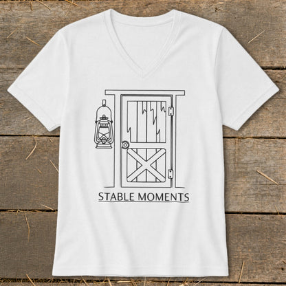 White t-shirt with a line drawing of a stable door and hanging lantern, text reads "STABLE MOMENTS".